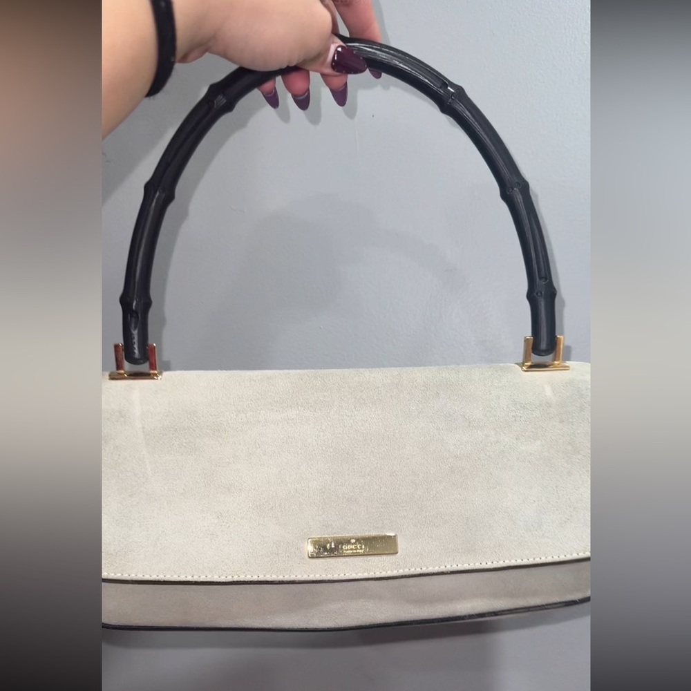 Elegant Cream Handbag with Black Handle